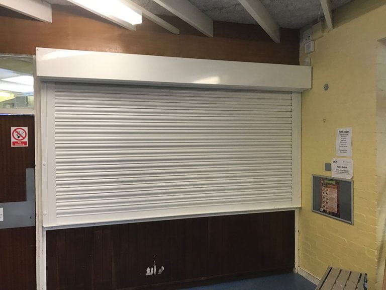 White-Electric-Operated-Scholl-Roller-Shutter- Westwood Security Shutters Ltd.